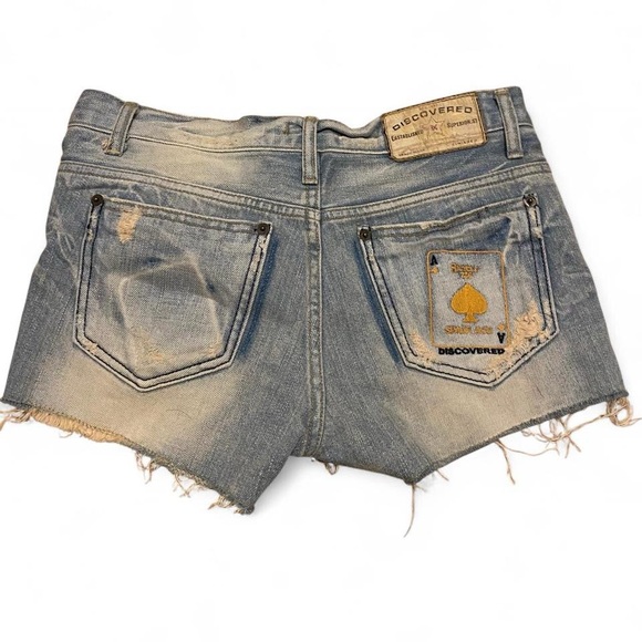 Pants - Women's distressed low rise mini jean shorts with unique embroidered design